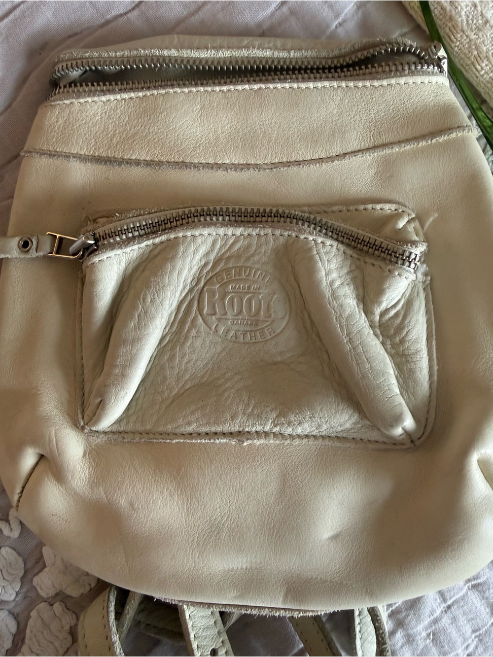 Roots Cream Leather Backpack with Front Zip Pocket and Embossed Logo